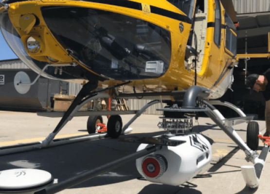 Picture of LiDARUSA's Long Range VUX-1LR hanging below a helicopter.
